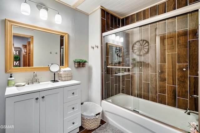 full bathroom with combined bath / shower with glass door and vanity