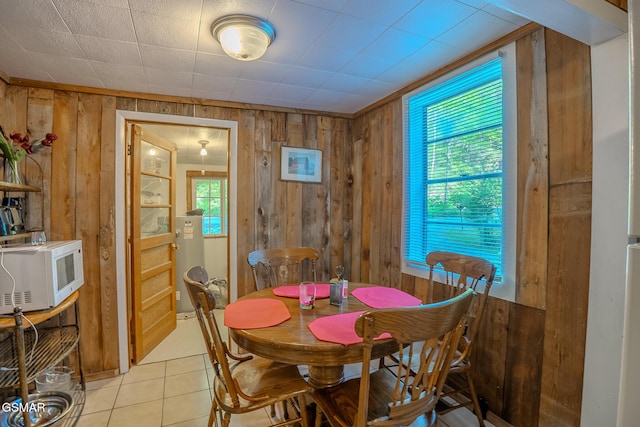 250 Cartertown Rd, Gatlinburg, TN 37738 - dining room featuring light tile patterned flooring and wooden walls