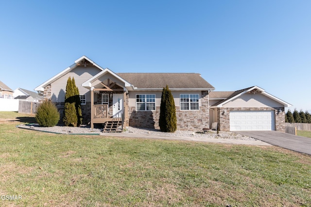 view of front of house featuring a front lawn and a garage