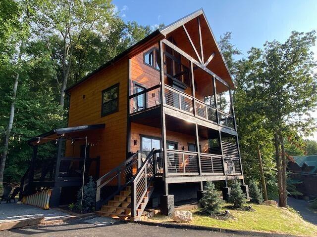 back of property featuring a balcony