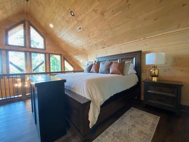 bedroom featuring lofted ceiling, wood ceiling, wooden walls, and dark hardwood / wood-style floors