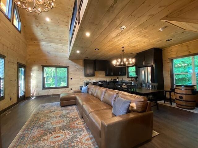 living room featuring wood ceiling, dark hardwood / wood-style floors, and plenty of natural light