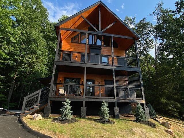 rear view of house featuring a balcony