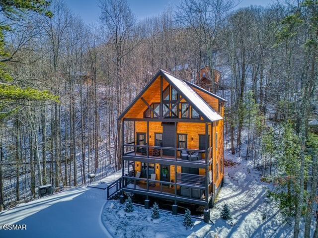 view of snow covered house