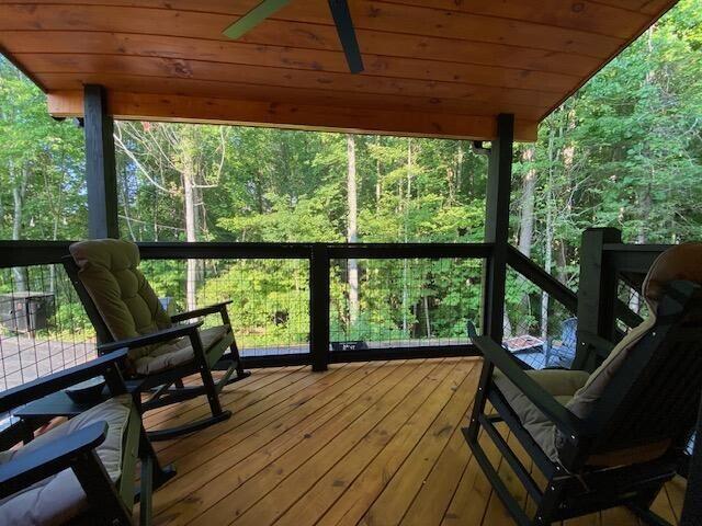 sunroom / solarium with a wealth of natural light and wood ceiling