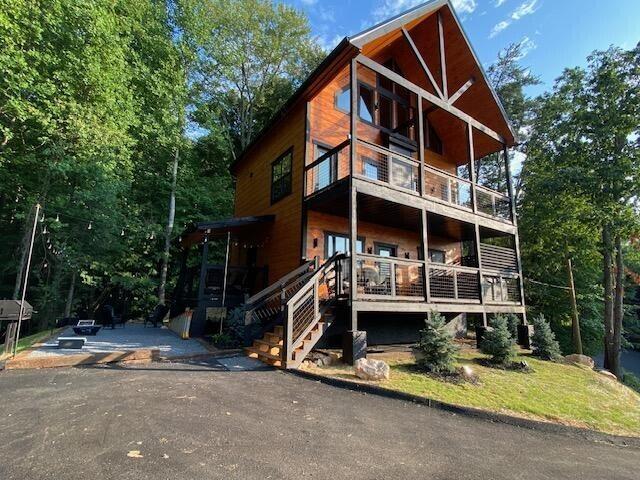 view of front of house featuring a balcony