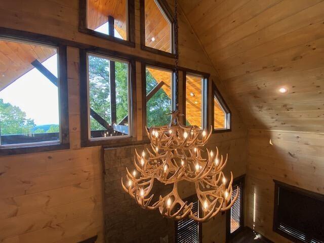 interior details featuring wood ceiling and wooden walls