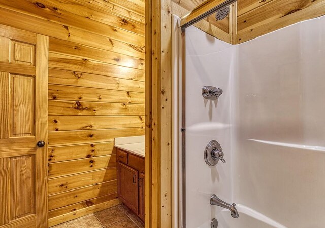 bathroom with wood walls