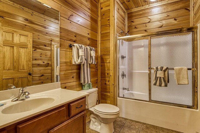 full bathroom with wooden ceiling, toilet, wooden walls, and enclosed tub / shower combo