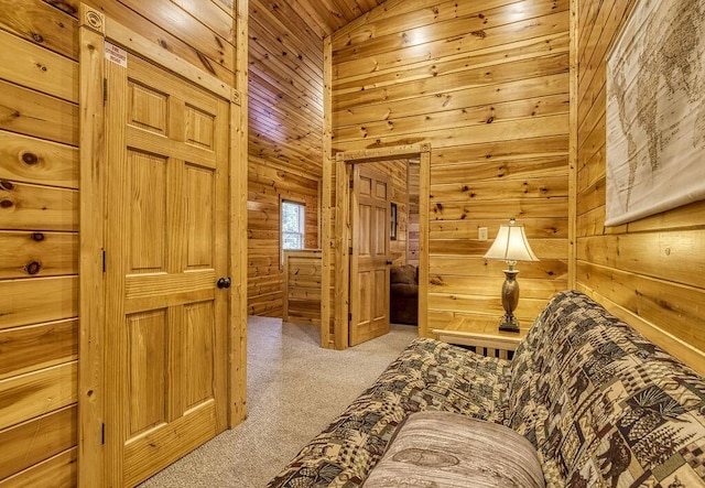 living area featuring light carpet, lofted ceiling, wooden ceiling, and wooden walls