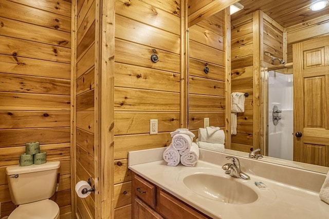 bathroom featuring vanity, wood walls, toilet, an enclosed shower, and wood ceiling