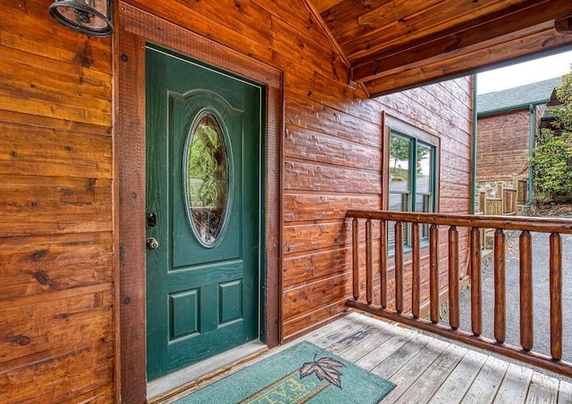 doorway to property featuring covered porch