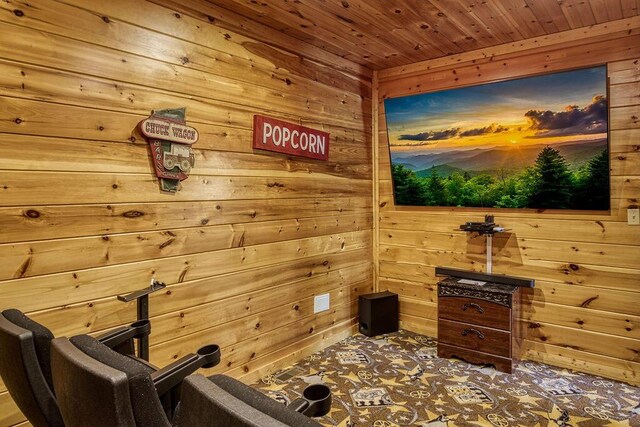 home theater featuring wooden walls and wood ceiling