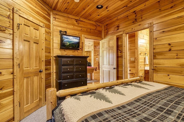 bedroom with carpet, wood walls, and wood ceiling