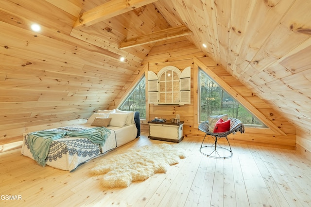 bedroom featuring lofted ceiling with beams, wooden ceiling, wood walls, multiple windows, and hardwood / wood-style floors