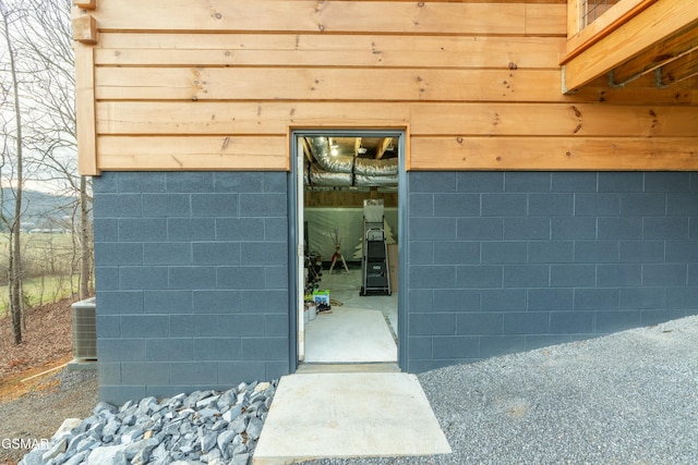 doorway to property with central air condition unit