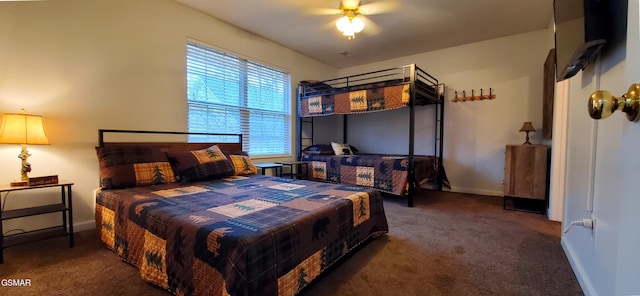 carpeted bedroom with ceiling fan and baseboards