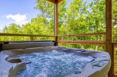 937 Pine Valley Way, Sevierville, TN 37862 - sunroom / solarium featuring a jacuzzi