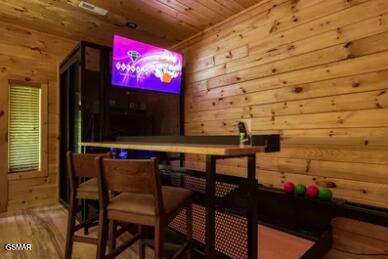 937 Pine Valley Way, Sevierville, TN 37862 - bar with wooden ceiling, wood finished floors, and wood walls