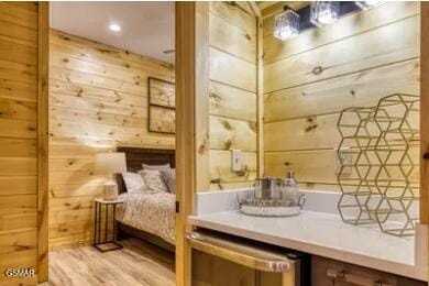 937 Pine Valley Way, Sevierville, TN 37862 - bathroom featuring wood walls and wood finished floors