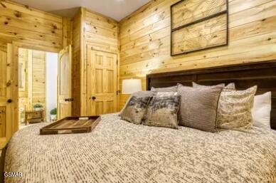 937 Pine Valley Way, Sevierville, TN 37862 - bedroom with wood walls