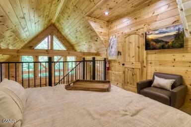 937 Pine Valley Way, Sevierville, TN 37862 - carpeted bedroom with wooden walls, wood ceiling, and vaulted ceiling