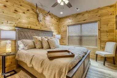 937 Pine Valley Way, Sevierville, TN 37862 - bedroom with wooden walls, wood finished floors, recessed lighting, and a ceiling fan