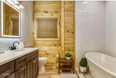 937 Pine Valley Way, Sevierville, TN 37862 - full bath with a freestanding bath, vanity, and wood finished floors