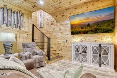 937 Pine Valley Way, Sevierville, TN 37862 - living area featuring wood walls, wood finished floors, stairway, and wooden ceiling