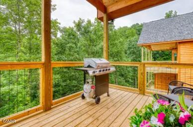 937 Pine Valley Way, Sevierville, TN 37862 - wooden deck featuring grilling area and a view of trees