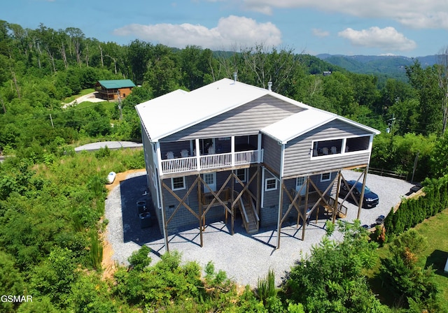 1156 Hemlock Dr, Gatlinburg, TN 37738 - back of house with a patio, a forest view, stairway, and a deck