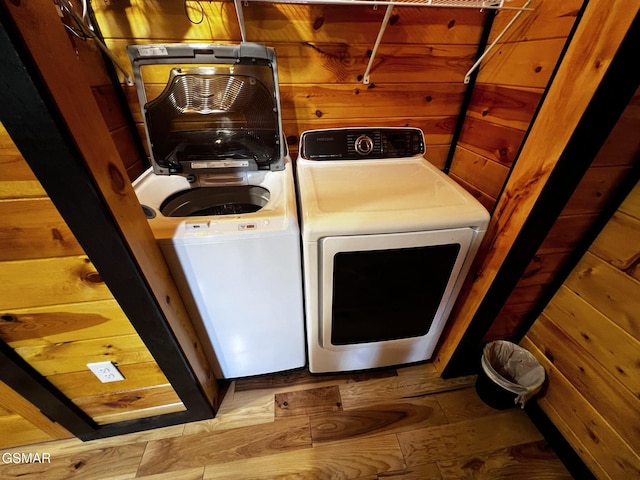 1156 Hemlock Dr, Gatlinburg, TN 37738 - laundry area featuring washer and clothes dryer and wood finished floors
