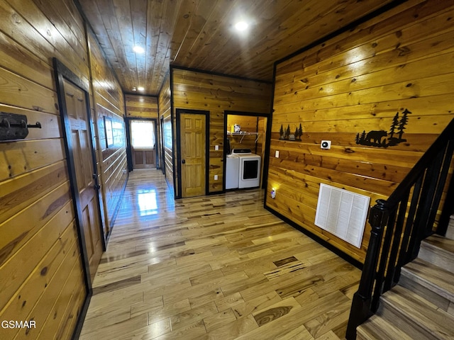 1156 Hemlock Dr, Gatlinburg, TN 37738 - kitchen with wood ceiling, wooden walls, light wood-style floors, washer / dryer, and recessed lighting
