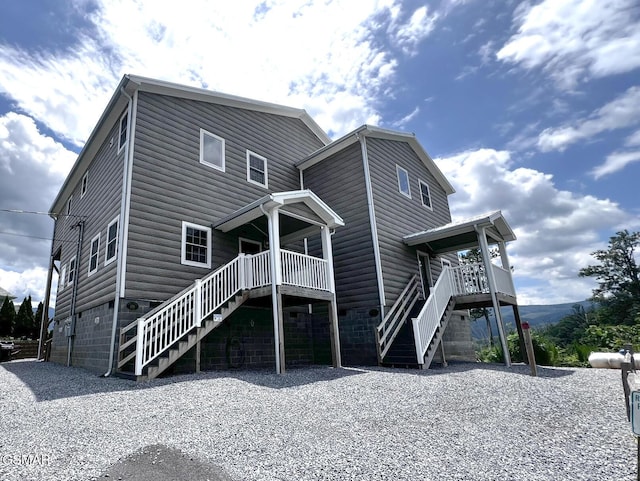 1156 Hemlock Dr, Gatlinburg, TN 37738 - rear view of property with stairs and faux log siding