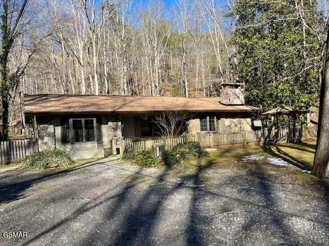 single story home with a gazebo