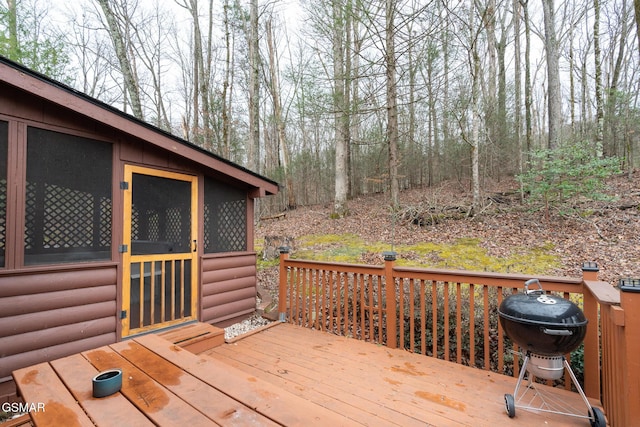 wooden terrace featuring grilling area