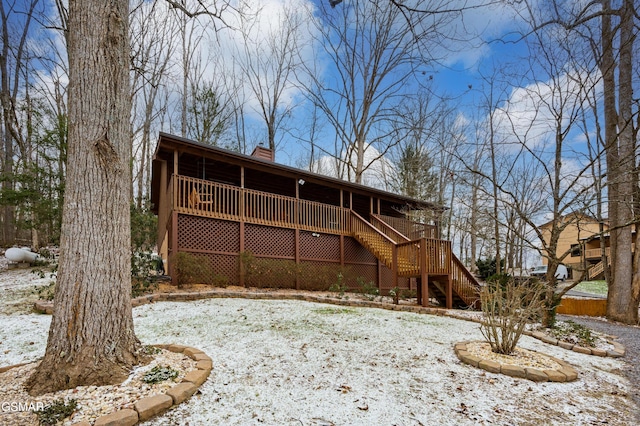 view of snow covered house