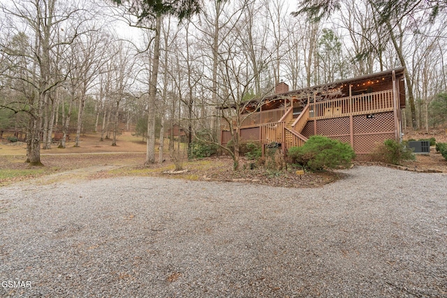 view of front of home featuring a deck and central AC