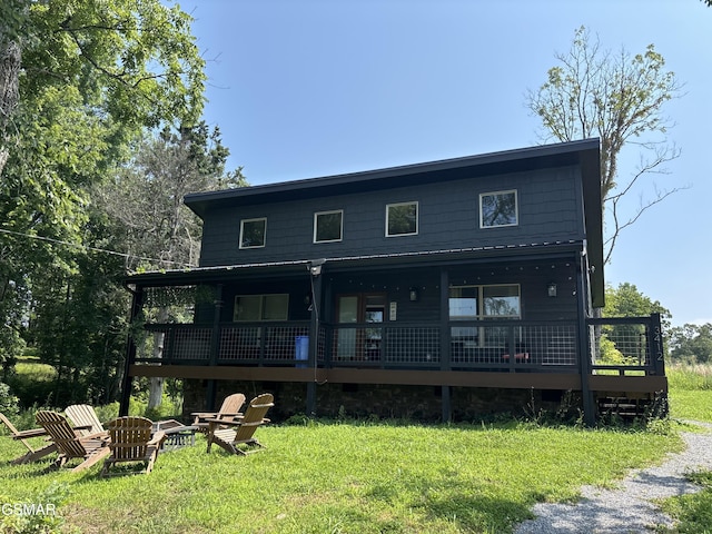3412 Worth Rd, Sevierville, TN 37876 - back of house with a fire pit and a lawn