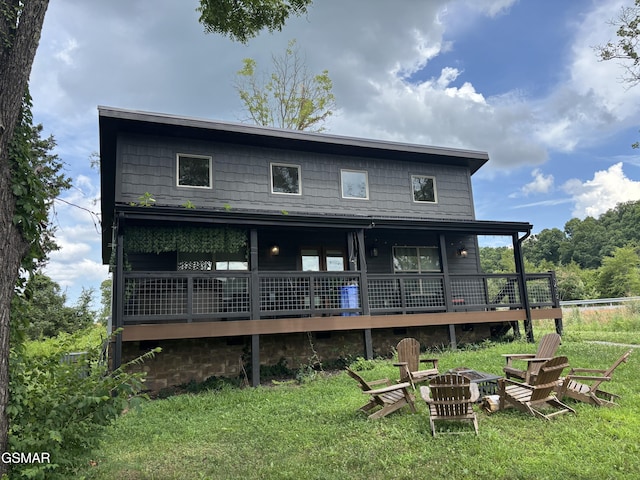3412 Worth Rd, Sevierville, TN 37876 - rear view of house with an outdoor fire pit, a yard, and a deck