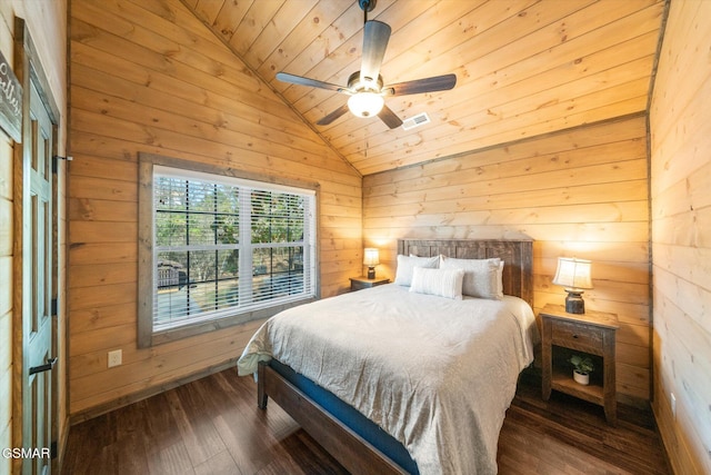 bedroom with lofted ceiling, wood ceiling, dark wood-type flooring, and wood walls