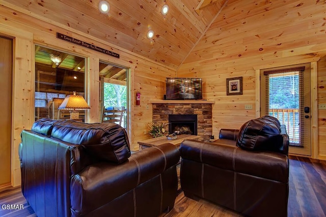 living room with hardwood / wood-style flooring, vaulted ceiling, and wooden walls