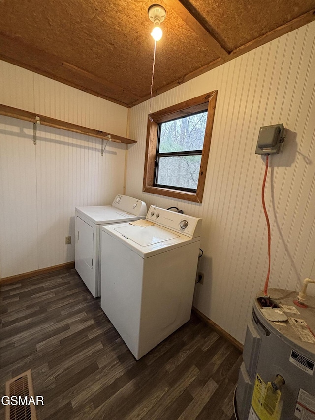 washroom with wood ceiling, water heater, wooden walls, dark hardwood / wood-style floors, and separate washer and dryer