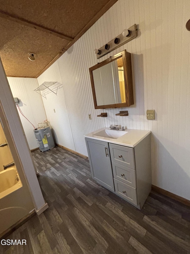 bathroom featuring vanity, hardwood / wood-style floors, and wood walls