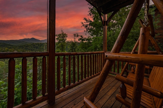 deck at dusk with a mountain view