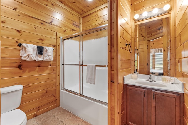 full bath featuring tile patterned floors and wooden walls