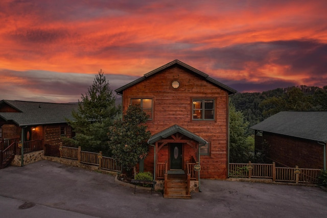 rustic home with fence