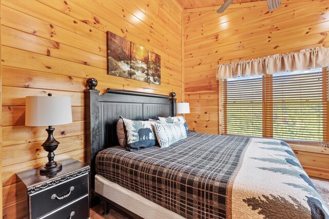 bedroom with wooden walls