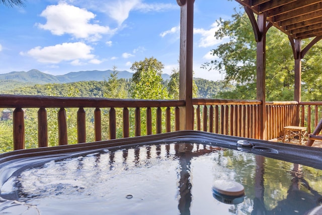 wooden terrace featuring a mountain view