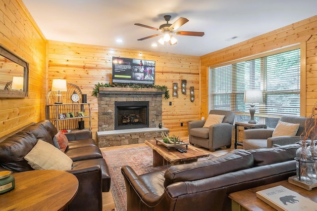 510 Hemlock St, Gatlinburg, TN 37738 - living room with a fireplace, ceiling fan, and wooden walls